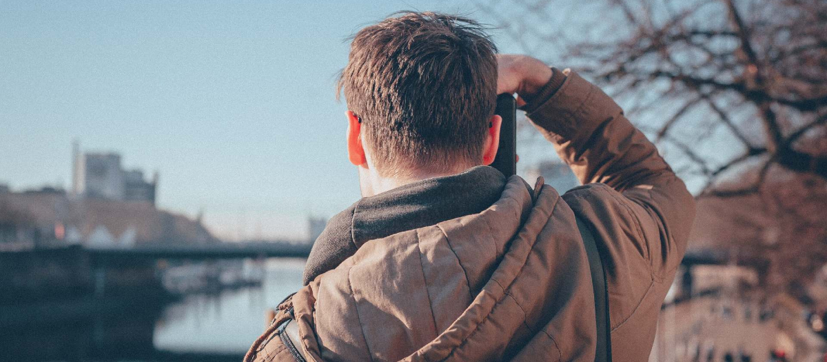 Man looking into distance with camera