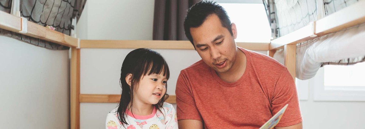 child with parent reading